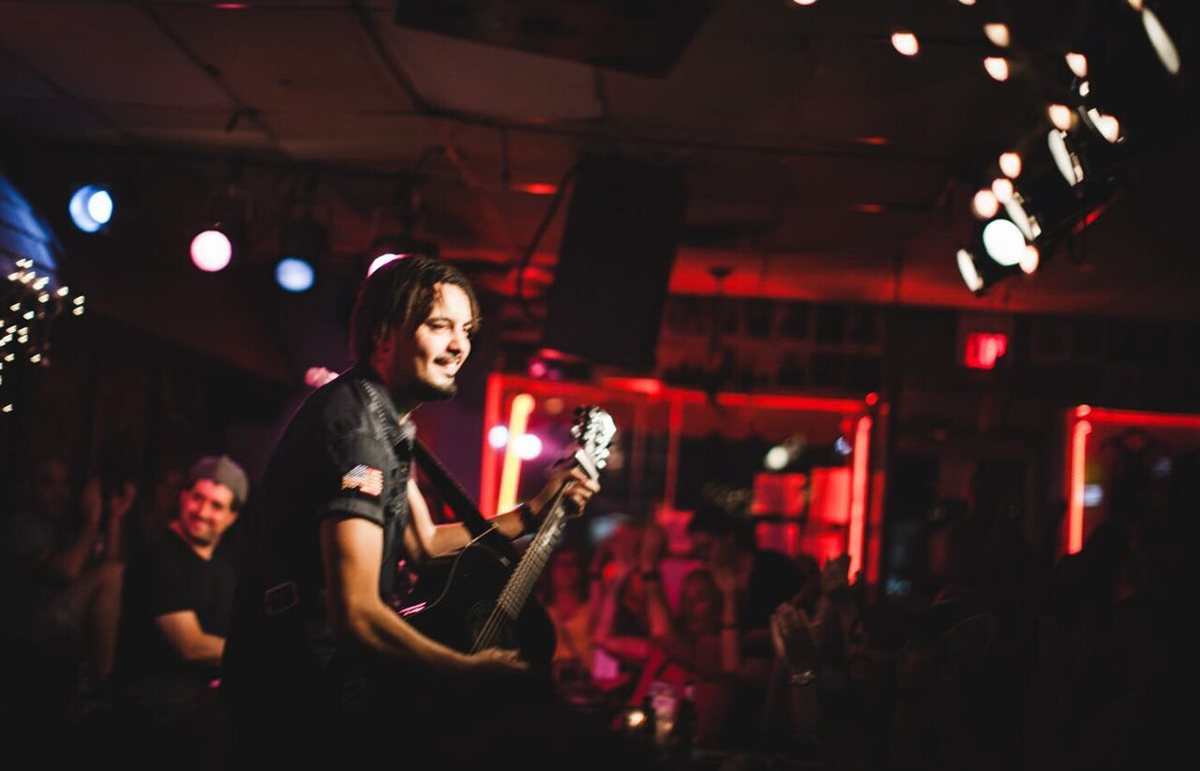 Songwriters performing in the round at the Bluebird Cafe listening room