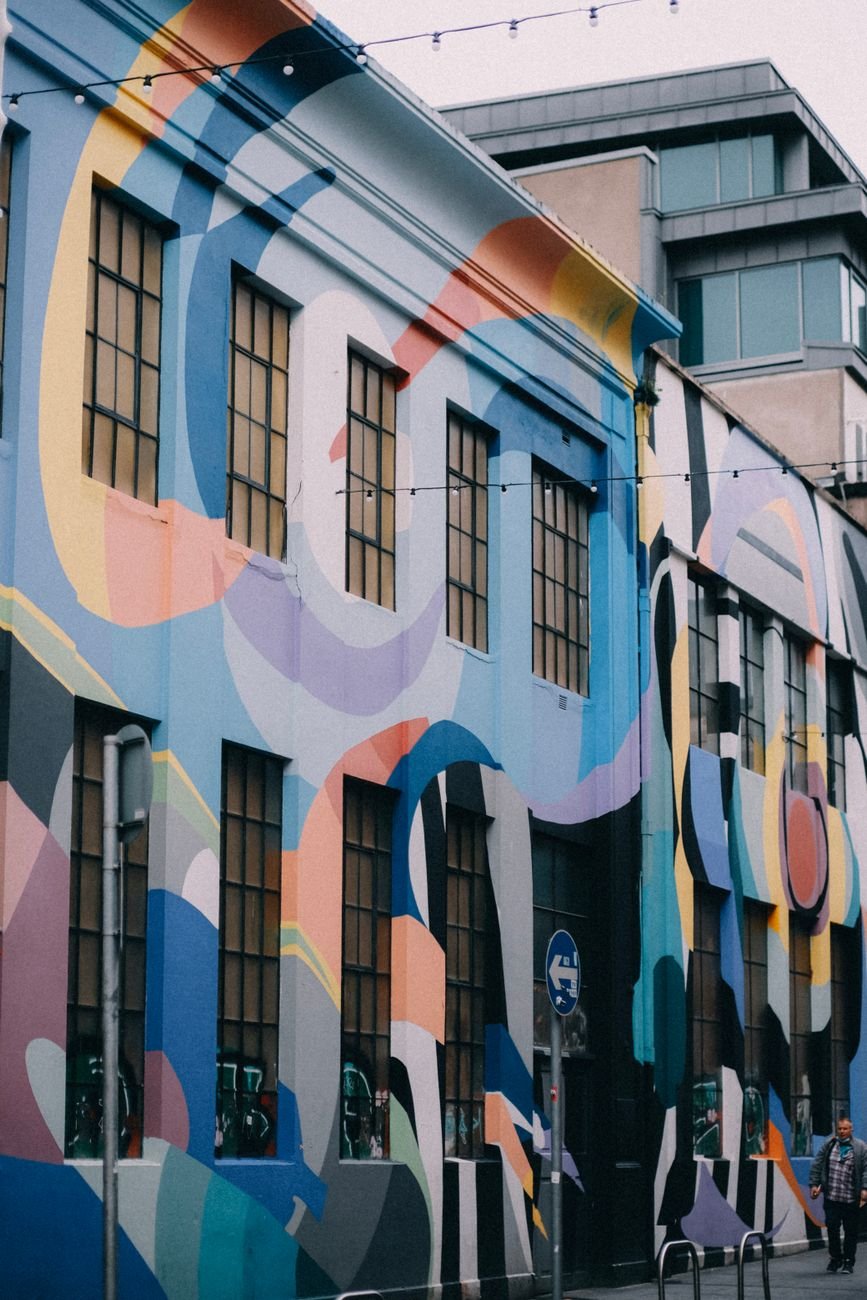 a large mural painted on a Gulch building wall